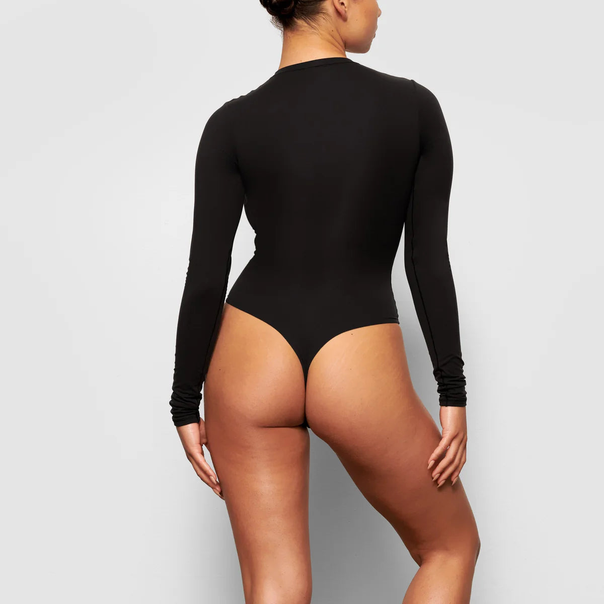 Langærmet bodysuit